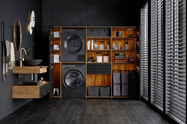 Well organized laundry room with grey laminate floors